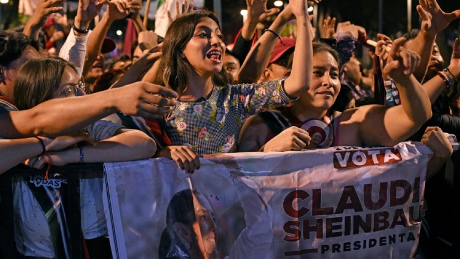 Supporters of Mexico's new president Claudia Sheinbaum wait for her at a hotel prior to her election win on June 2, 2024 