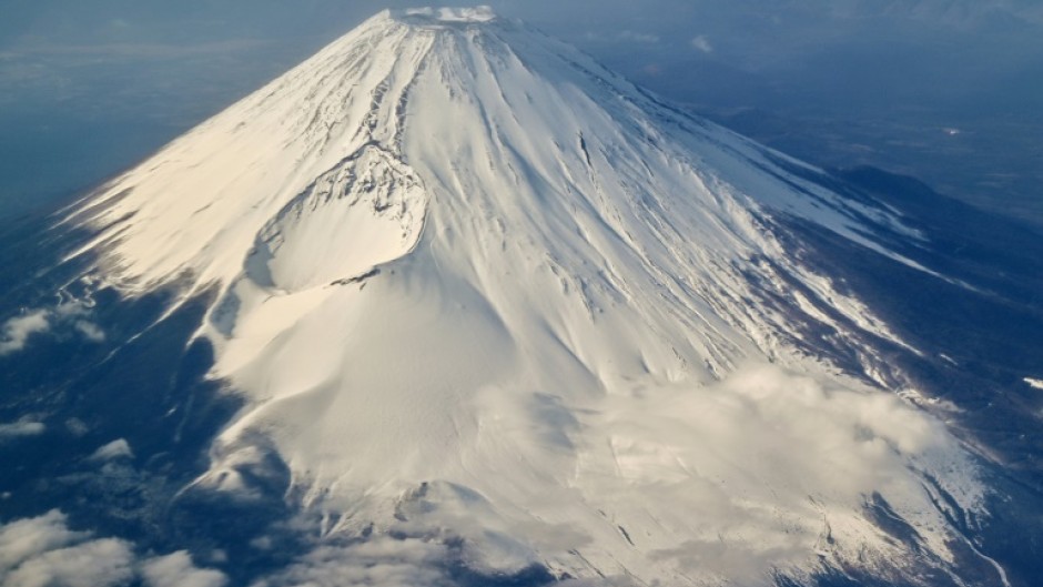 Tourists are flocking to take photos of Japan's highest peak Mount Fuji