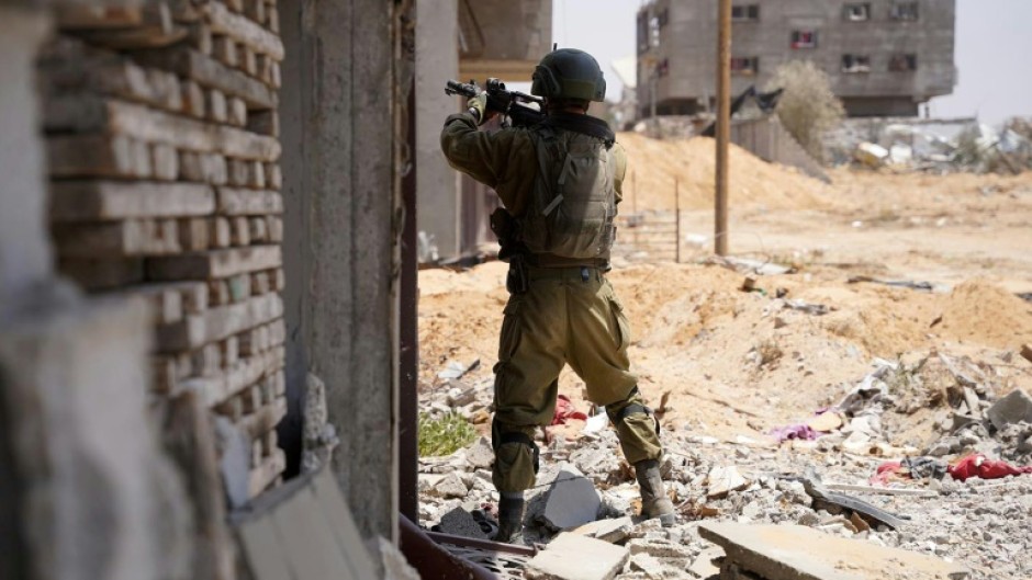 An Israeli soldier takes aim during operations in the Gaza Strip