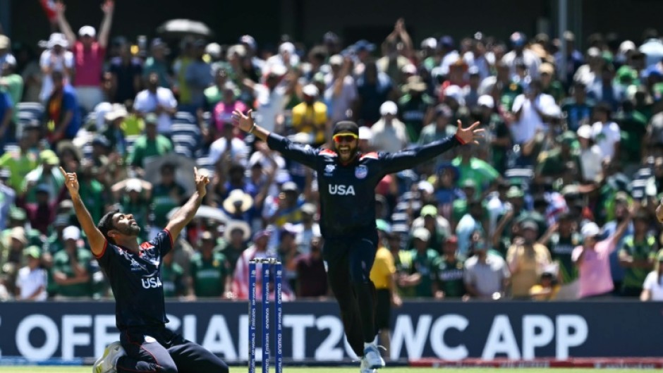 The USA's Saurabh Nethralvakar (left) celebrates after securing a shock win over Pakistan at the T20 Cricket World Cup