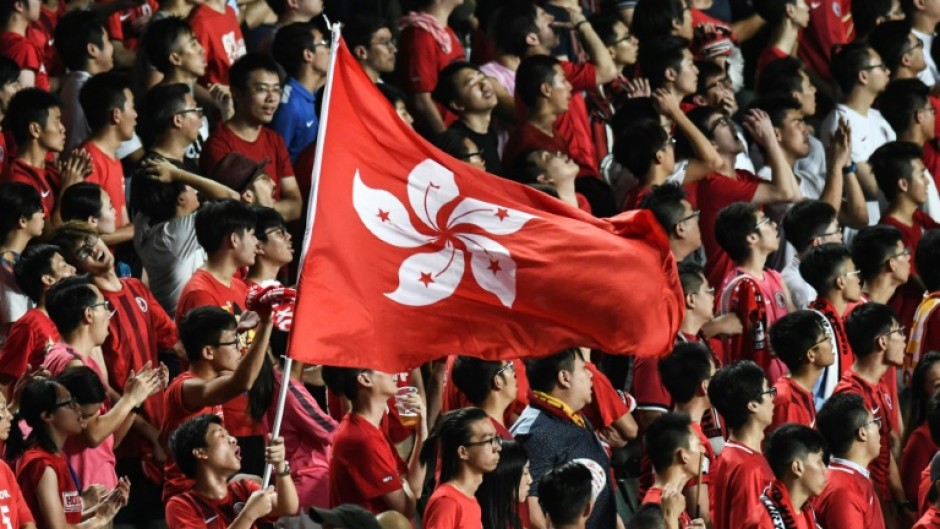 In this picture taken in 2017, Hong Kong fans hold their flag during a match