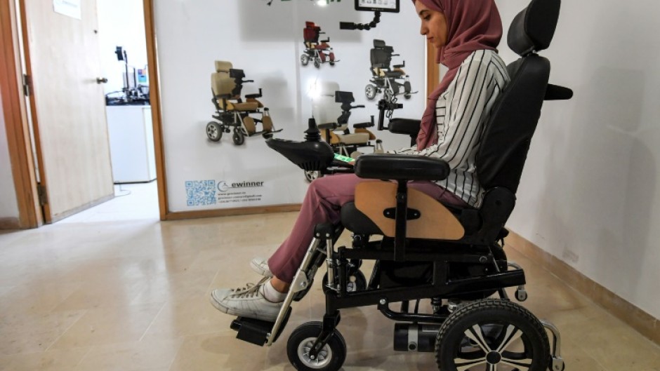 Tunisian engineer Souleima Ben Tamime tests a prototype of her team's new wheelchair system