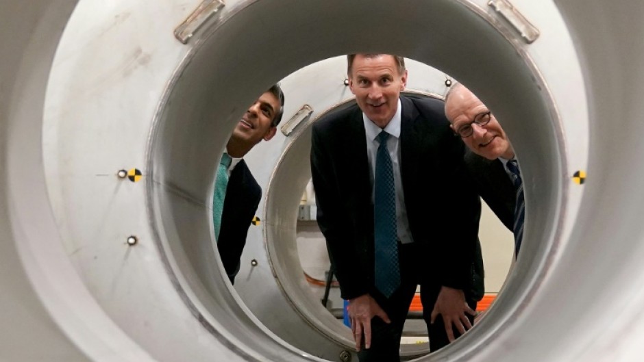 Prime Minister Rishi Sunak, left, and finance minister Jeremy Hunt, centre, are facing an expected election wipe-out