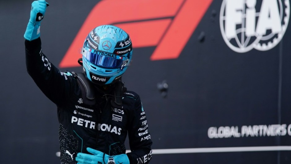 Mercedes' British driver George Russell celebrates winning pole for the Canada Grand Prix 