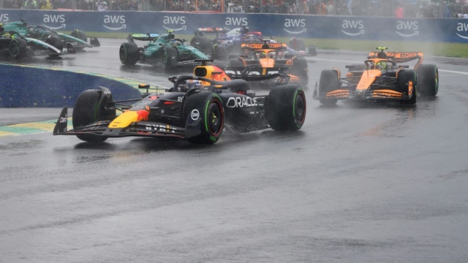 Max Verstappen leads Lando Norris as the spray flies at the Canadian  Grand Prix