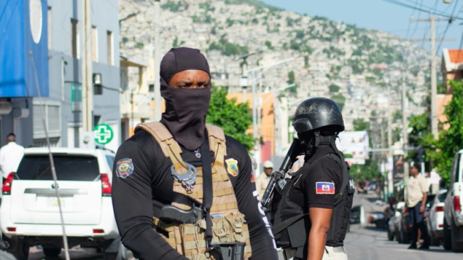 Police outside the hospital where Haiti's Prime Minister Garry Conille was briefly hospitalized in Port-au-Prince