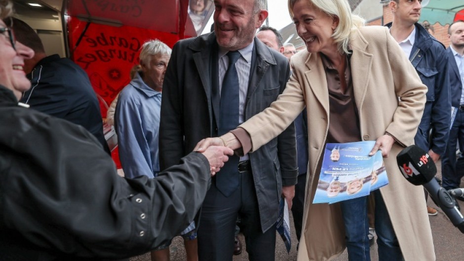 French far-right figurehead Marine Le Pen meets local residents during a campaign visit to the northern town of Henin-Beaumont