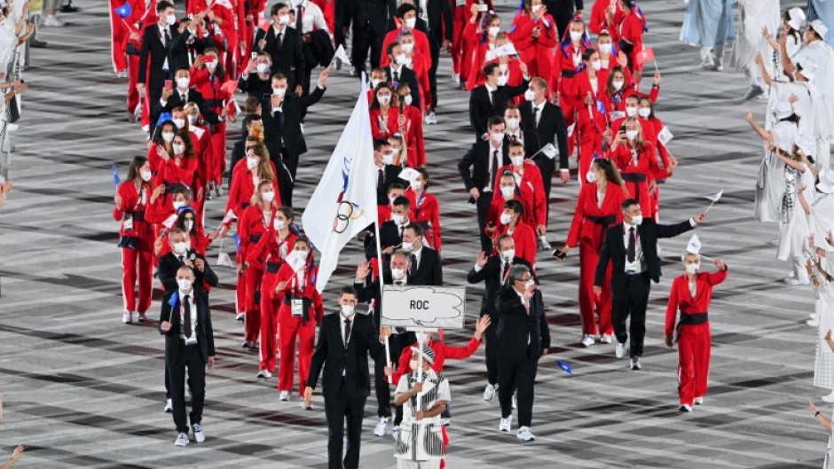 After a drugs scandal, Russian competitors at the Tokyo Games marched at the opening ceremony behind the Russian Olympic Committee flag