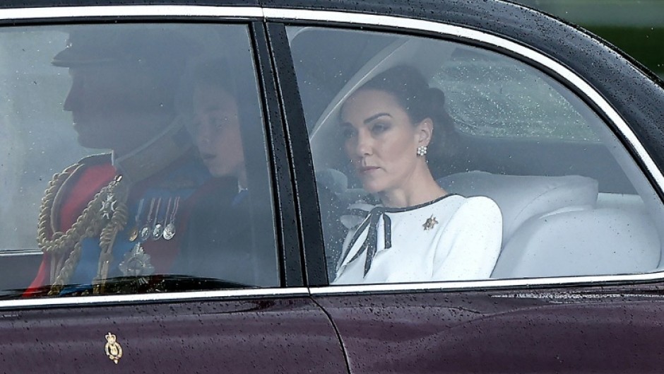 Kate (R) arrived at Buckingham Palace with her husband and children