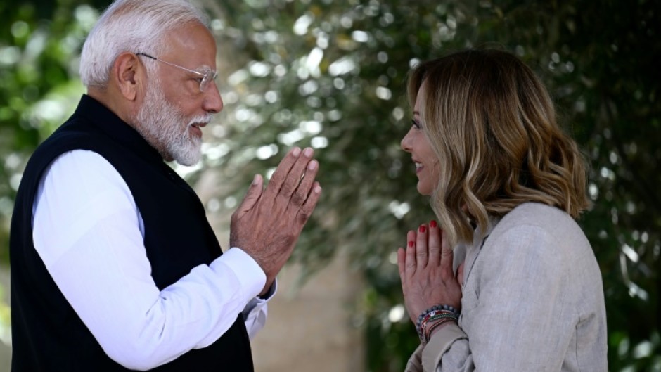 Indian Prime Minister Narendra Modi is welcomed by Italy's Prime Minister Giorgia Meloni on June 14