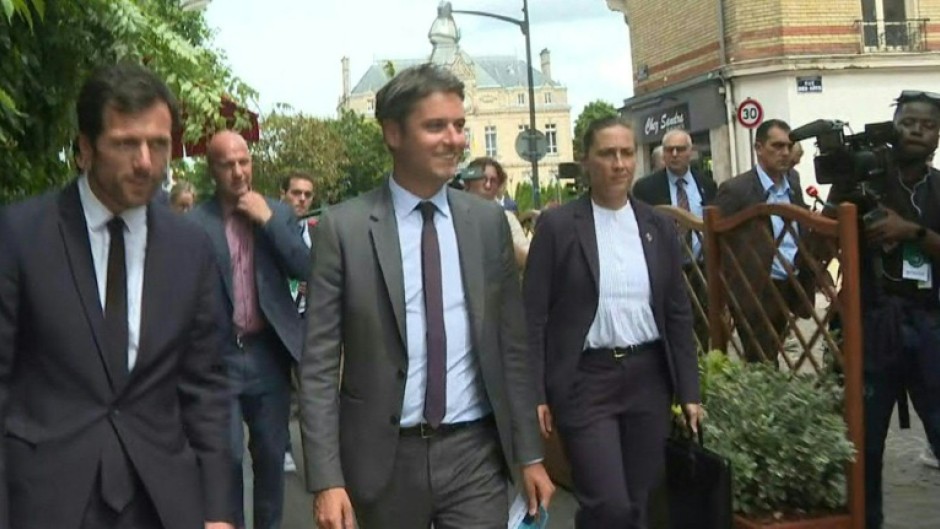 French PM campaigning for the general election near Paris