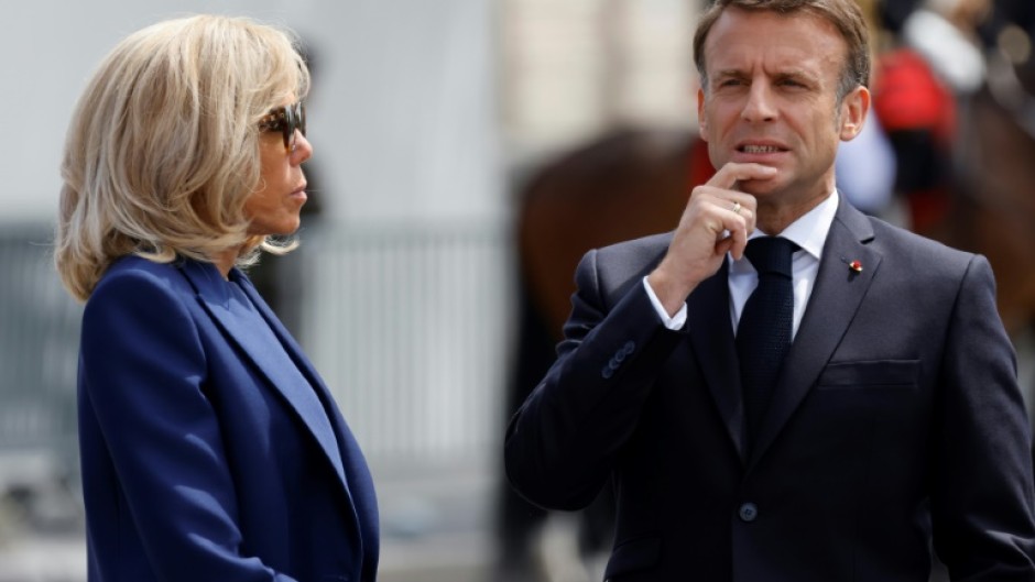 France's President Emmanuel Macron and his wife Brigitte Macron attend a ceremony at the Arc de Triomphe in Paris on June 8, 2024