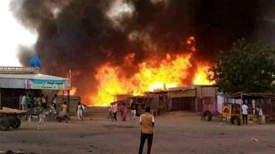 A fire rages in a livestock market in El-Fasher, in the aftermath of RSF bombing