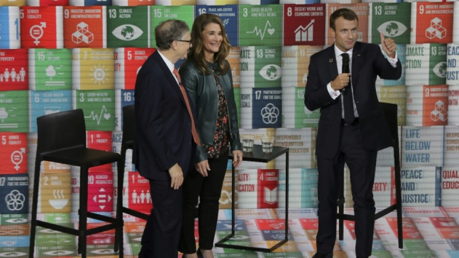 Melinda French Gates, pictured in 2018 with Bill Gates (left) and French President Emmanuel Macron, has pledged to use her fortune to help women and families 