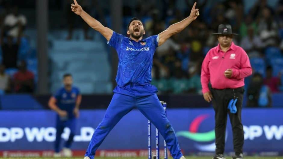 Afghanistan's Gulbadin Naib celebrates after the dismissal of  Australia's Glenn Maxwell during the T20 World Cup Super Eights match on Saturday.