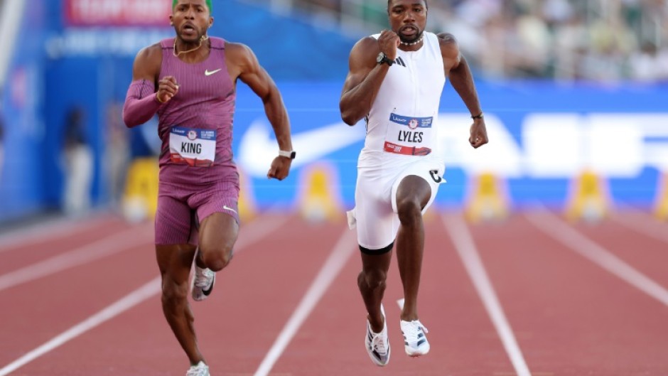 Reigning world champion Noah Lyles, right, won his preliminary heat over Kyree King, left, and other rivals at the US Olympic athletics trials to qualify for Sunday's semi-finals in Eugene, Oregon