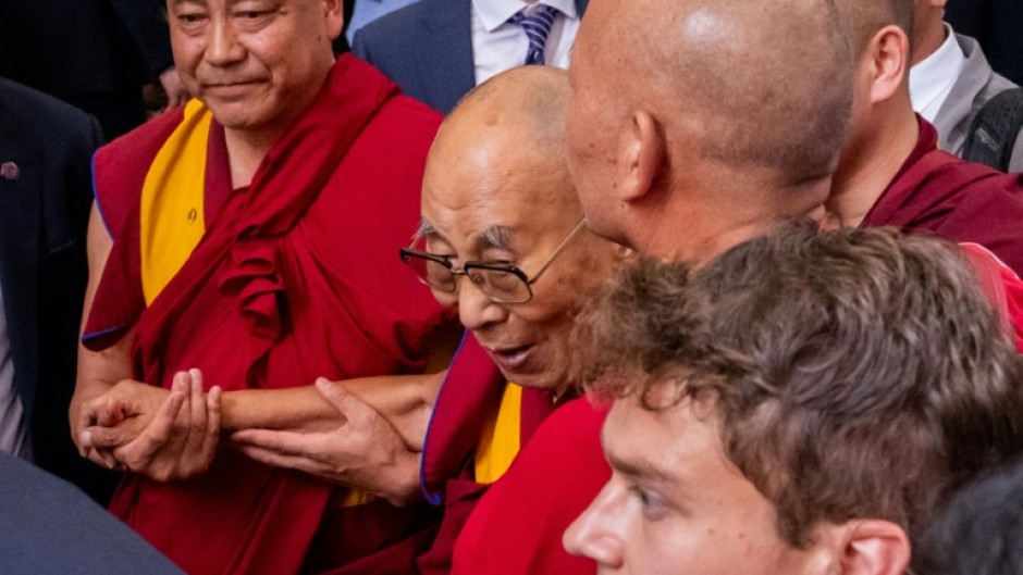 The Dalai Lama arrives at a hotel in New York, where he is scheduleld to undergo knee surgery