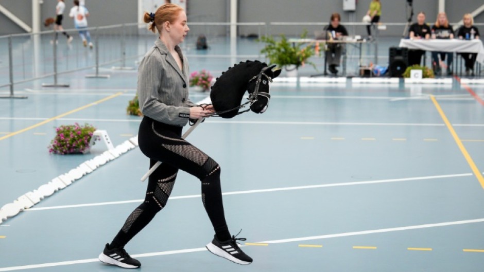 Giddy up: A rider takes part in a dressage event at the Finnish Hobbyhorse Championships 