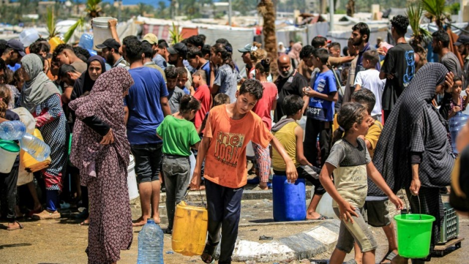 Gazans filling up water in Rafah, the southern city Israel described as Hamas's last stronghold