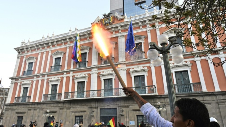 Supporters of Bolivian President Luis Arce gathered outside the Quemado Palace in La Paz after military police and troops cleared out