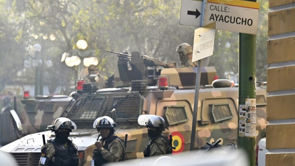 A soldier in an armored vehicle is deployed outside the Quemado Palace at Plaza Murillo in La Paz on June 26, 2024