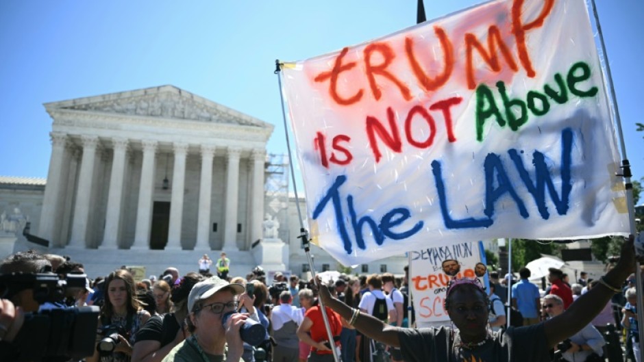 Anti-Trump demonstrators outside the Supreme Court as the justices delivered their ruling in the former president's immunity case