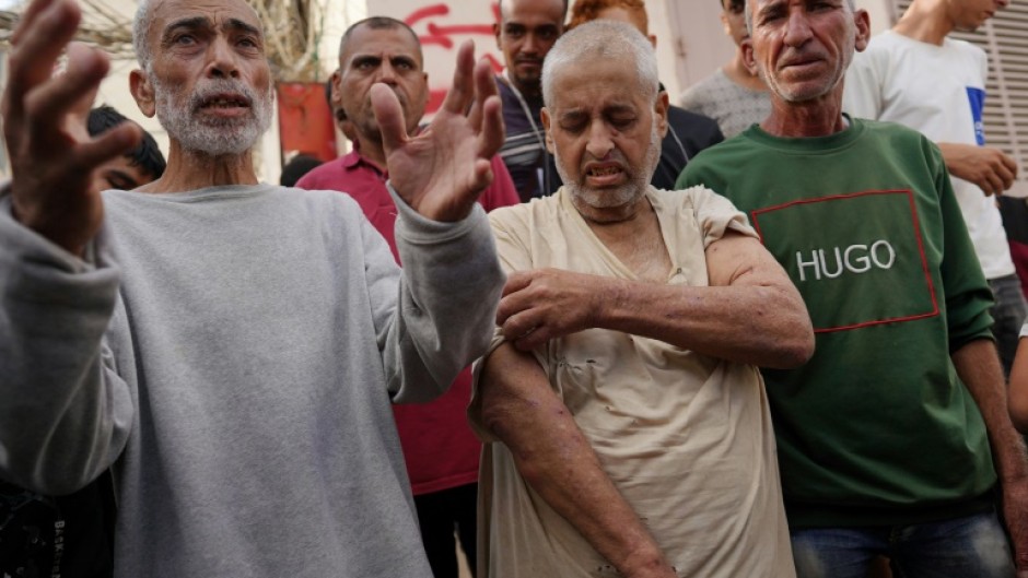 Palestinians who had been detained by Israel arrive for a check-up at Gaza's Al-Aqsa Martyrs Hospital in Deir al-Balah