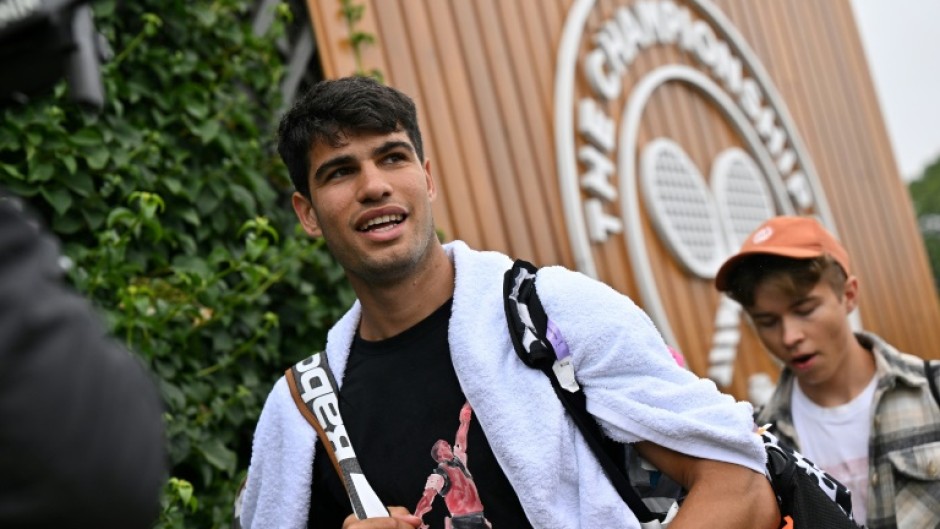 Champion: Carlos Alcaraz attends a training session at Wimbledon