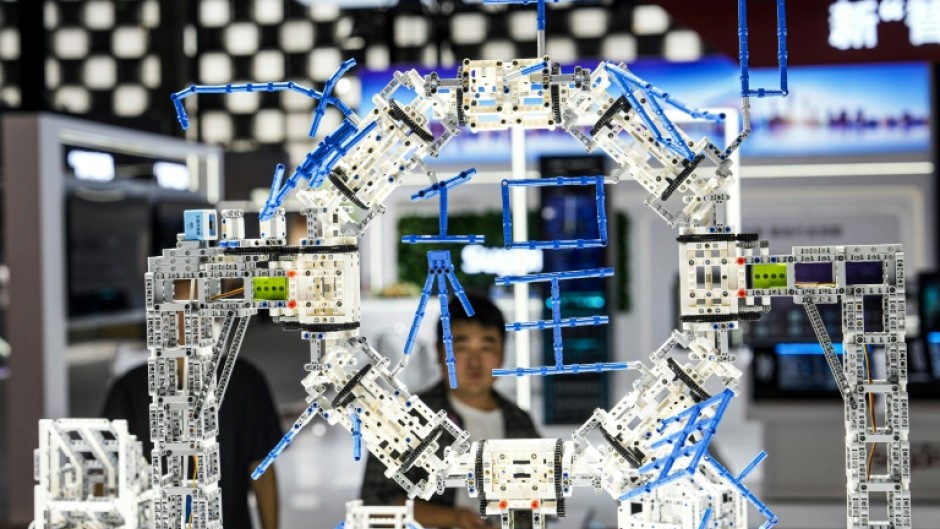 A man looks at a display at the artificial intelligence conference in Shanghai