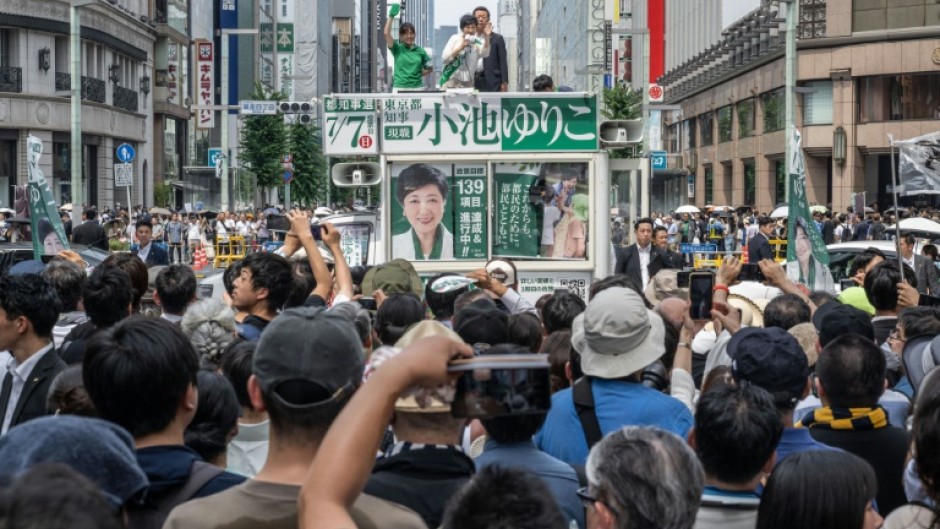 Polls suggest Tokyo governor Yuriko Koike (C at a campaign rally Saturday) will win a third term running the Japanese capital