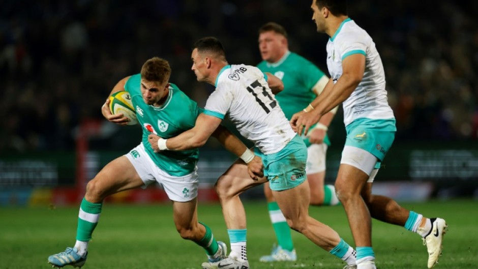 South Africa centre Jesse Kriel (2nd L) tackles Ireland fly-half Jack Crowley during the first Test in Pretoria. 