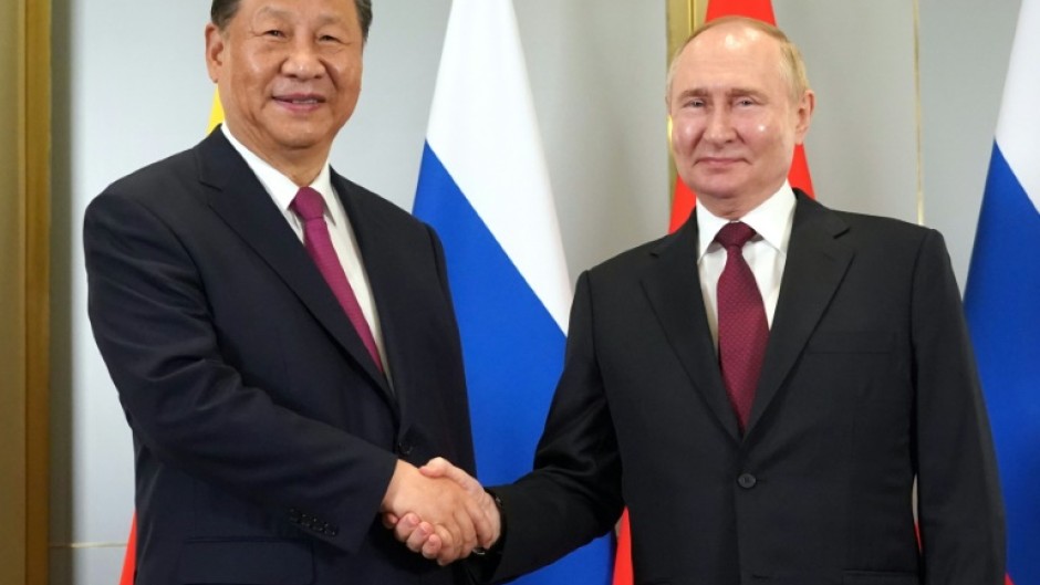 Xi Jinping, left, and Vladimir Putin want to challenge Washington's dominance in global affairs