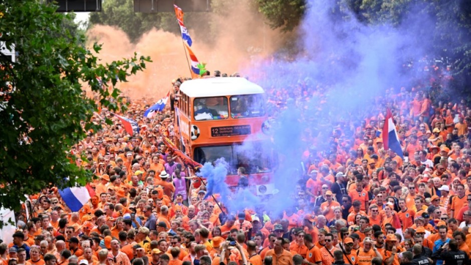 Dutch fans cheer in the streets of Dortmund ahead of Netherlands' Euro 2024 semi-final clash with England