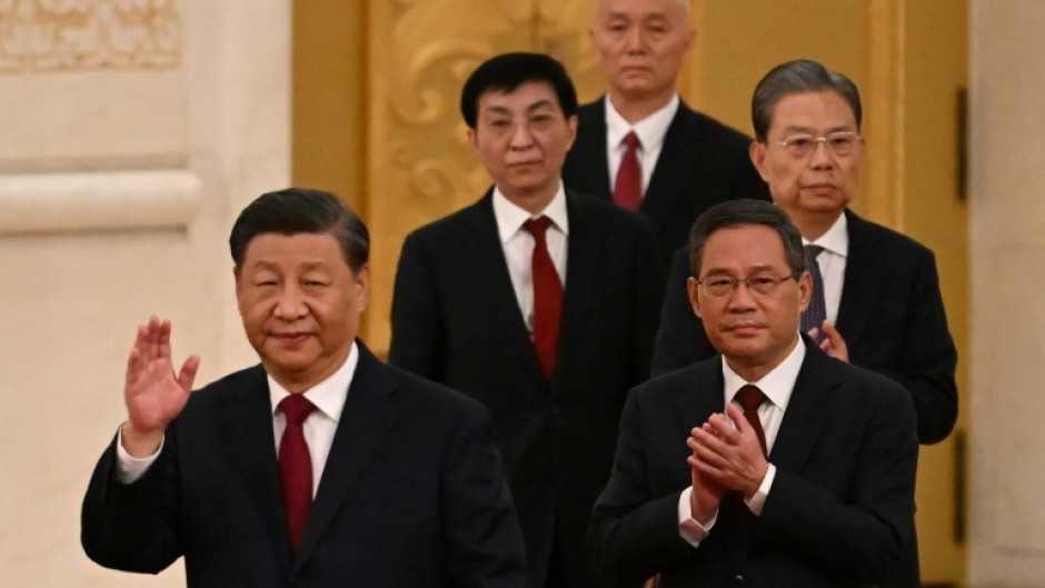 China's President Xi Jinping (L) and other top officials are gathering for the party's secretive Third Plenum on Monday