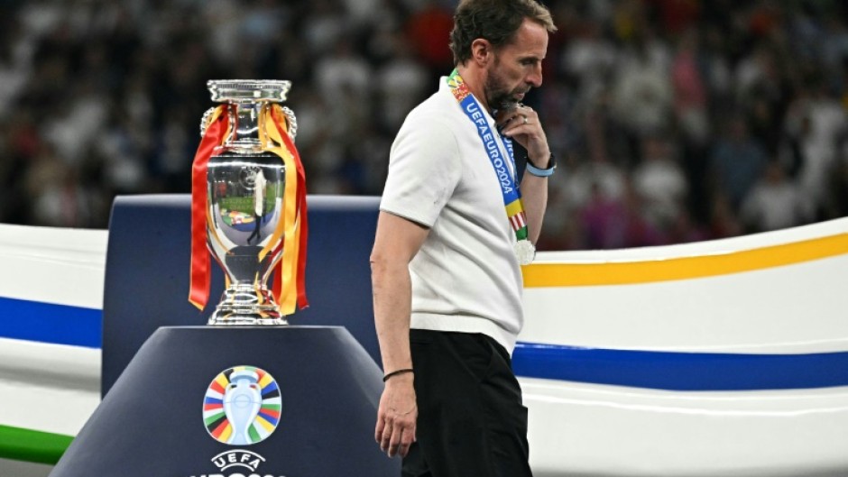 Gareth Southgate walks past the Euros trophy following the defeat to Spain