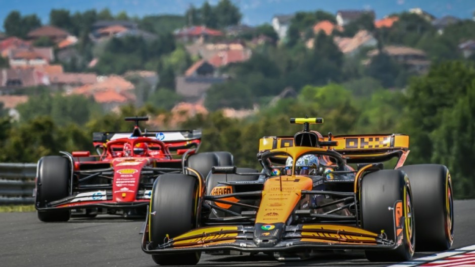 McLaren's British driver Lando Norris (R) at the Hungaroring race track in Mogyorod near Budapest