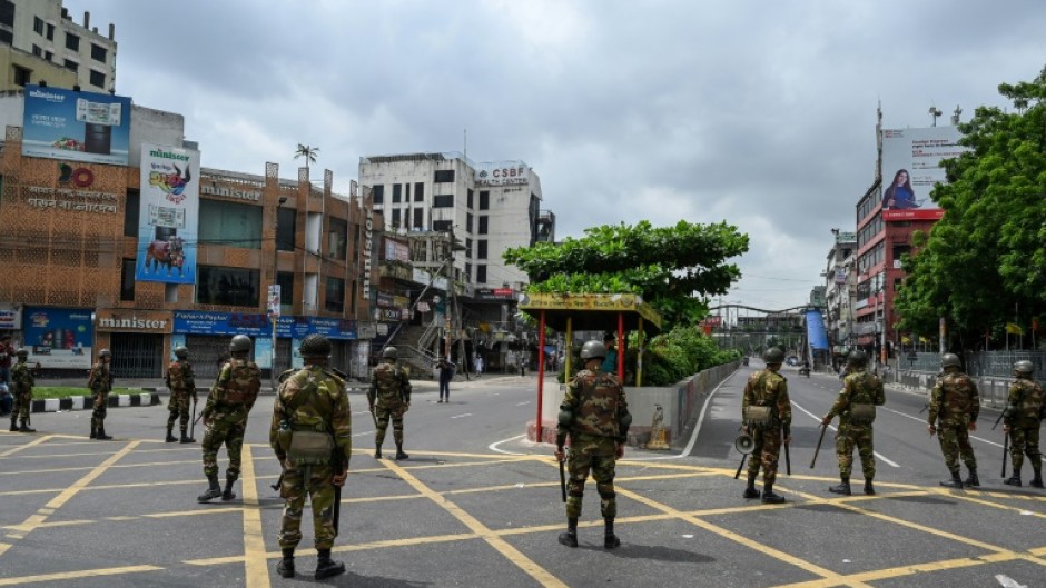 Bangladesh troops on patrol in the capital Dhaka after a curfew was announced