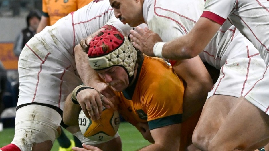 Australia's Fraser McReight scoring under pressure from Georgia at Allianz Stadium in Sydney