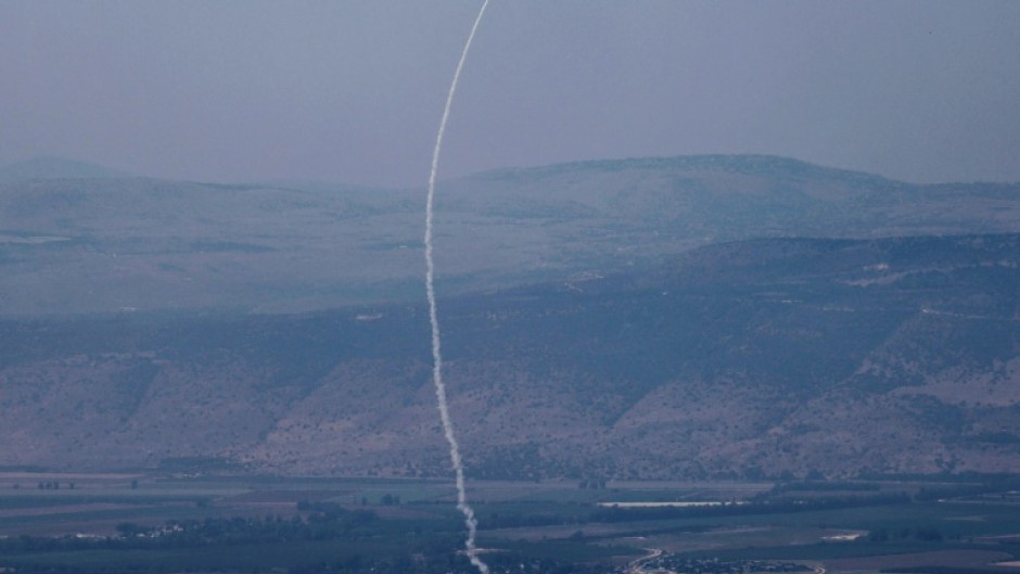 A rocket fired from southern Lebanon is intercepted by Israel's Iron Dome air defence system over northern Israel