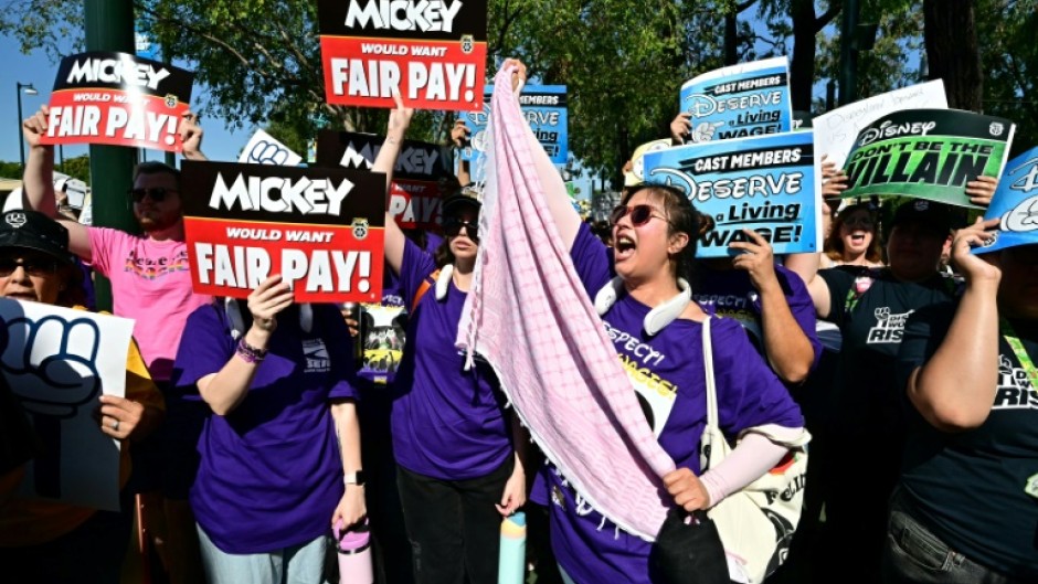 Disney employees rally outside the main entrance of Disneyland Resort in Anaheim, California, on July 17, 2024, ahead of a planned strike authorization vote