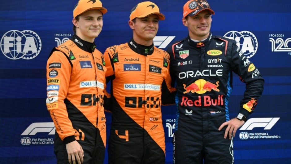 Max Verstappen (right) was overshadowed by the McLaren men in qualifying for Sunday's Hungarian Grand Prix 