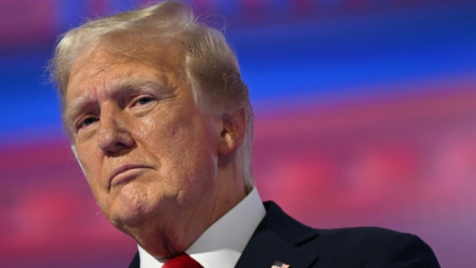 Former US president and 2024 Republican White House candidate Donald Trump stands on stage after accepting his party's presidential nomination 