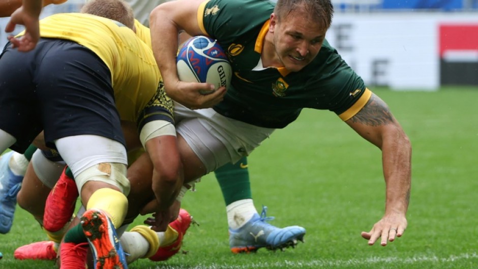 Andre Esterhuizen (R) playing for South Africa against Romania in the 2023 Rugby World Cup in France.