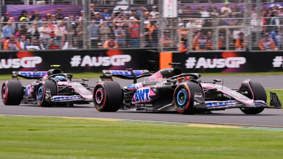 Esteban Ocon (R) and fellow Alpine driver Pierre Gasly (L) share the track in practice ahead of the Australian Grand Prix in March