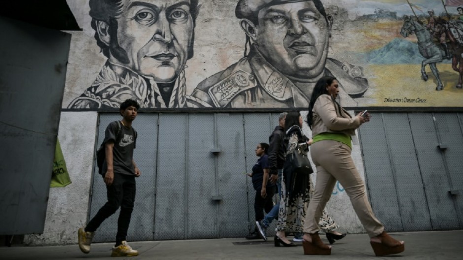 Graffiti depicting liberator Simon Bolivar and Venezuelan late president Hugo Chavez in Caracas in April 2024