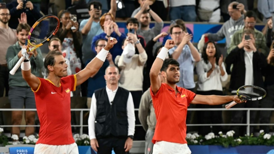 Dream team: Rafael Nadal and Carlos Alcaraz celebrate after beating Argentina's Maximo Gonzalez and Andres Molteni 