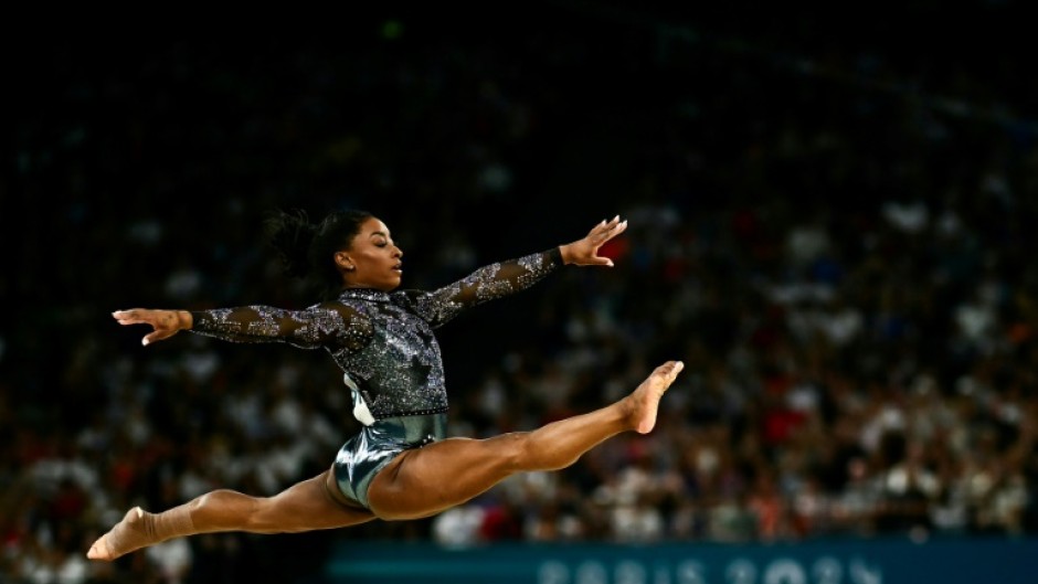 Simone Biles competes in floor exercise in women's gymnastics qualifying at the Paris Olympics