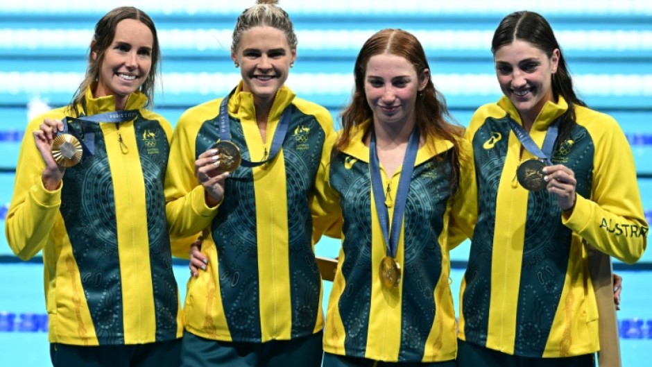 Gold medallists Australia pose with their medals following the women's 4x100m freestyle relay