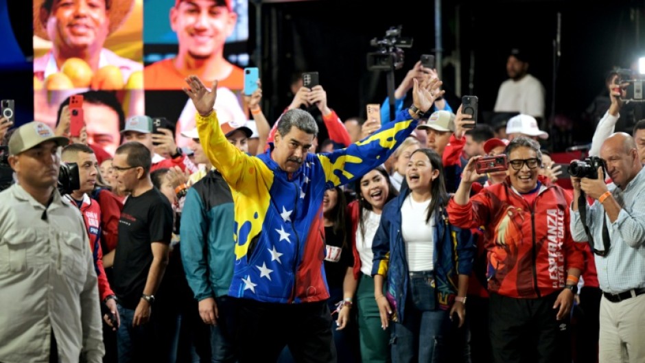 Venezuelan President Nicolas Maduro reacts after results were announced in Caracas in the country's presidential election, in which Maduro was declared the winner and opposition groups protested