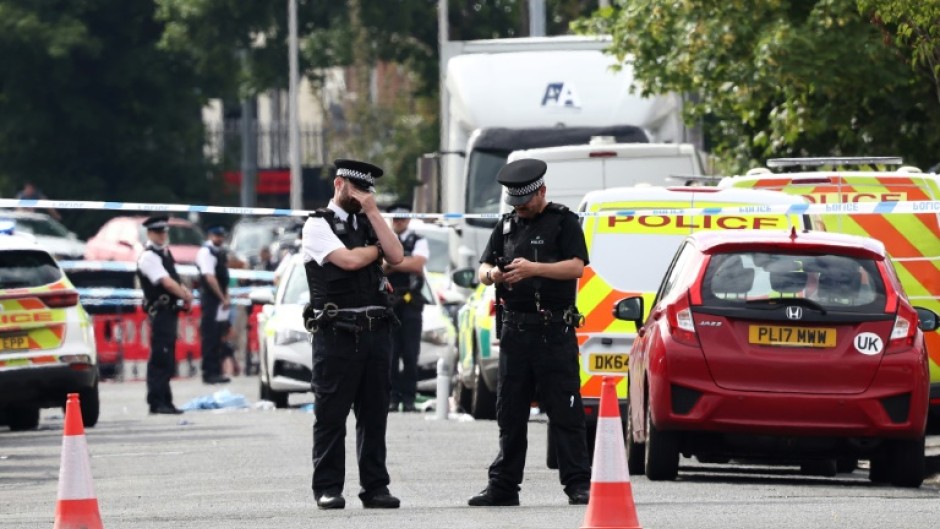 Police officers in Southport, northwest England, following the knife attack